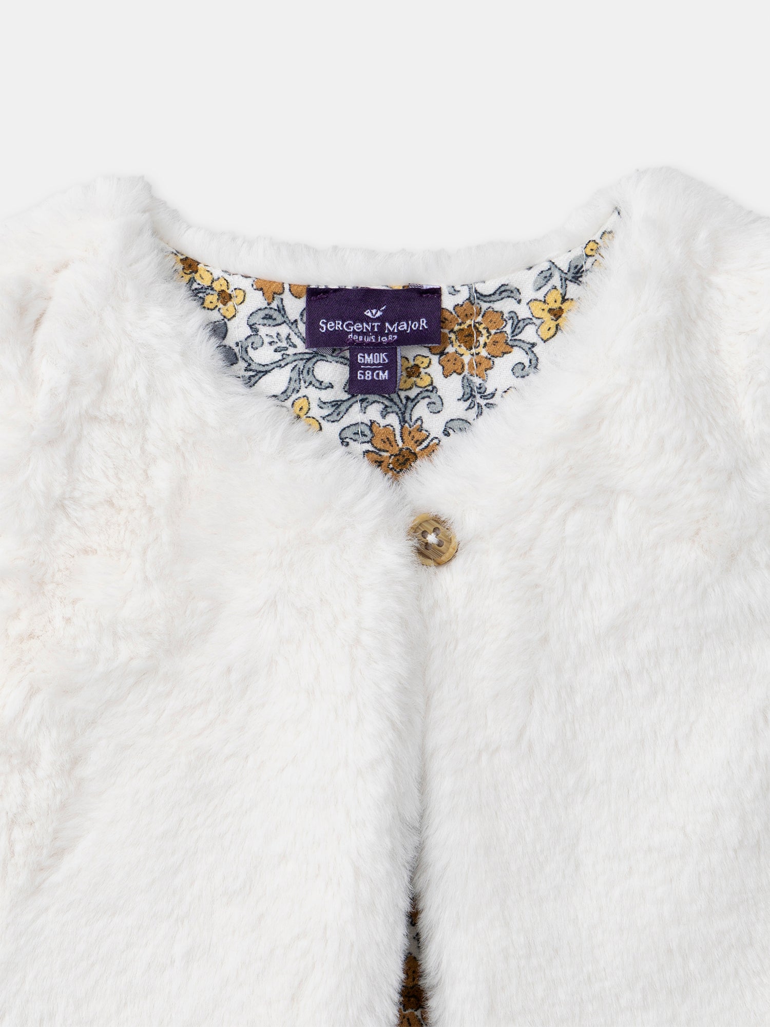 Gilet réversible blanc en fourrure ou imprimé fleuri Bébé Fille