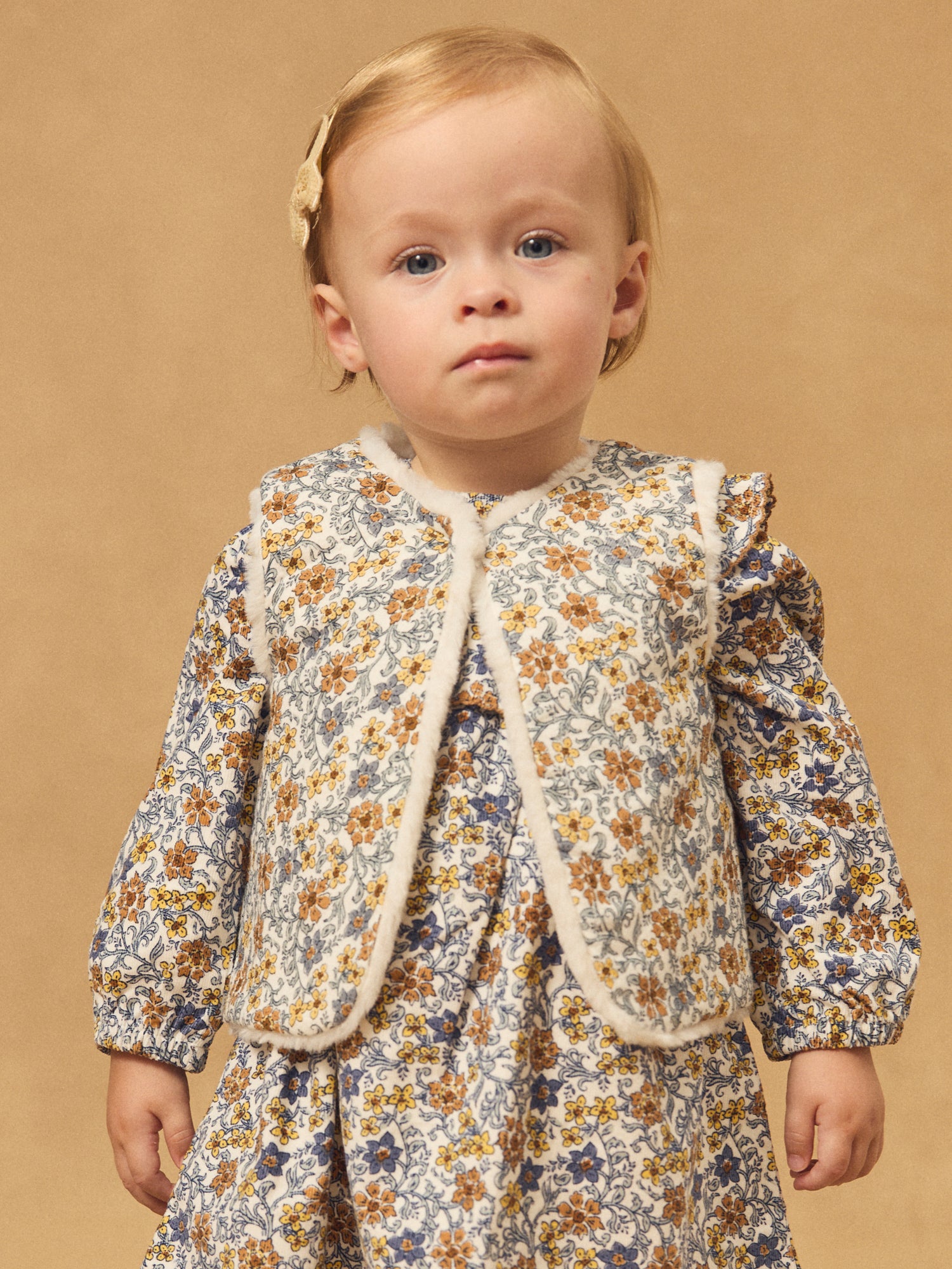 Gilet réversible blanc en fourrure ou imprimé fleuri Bébé Fille