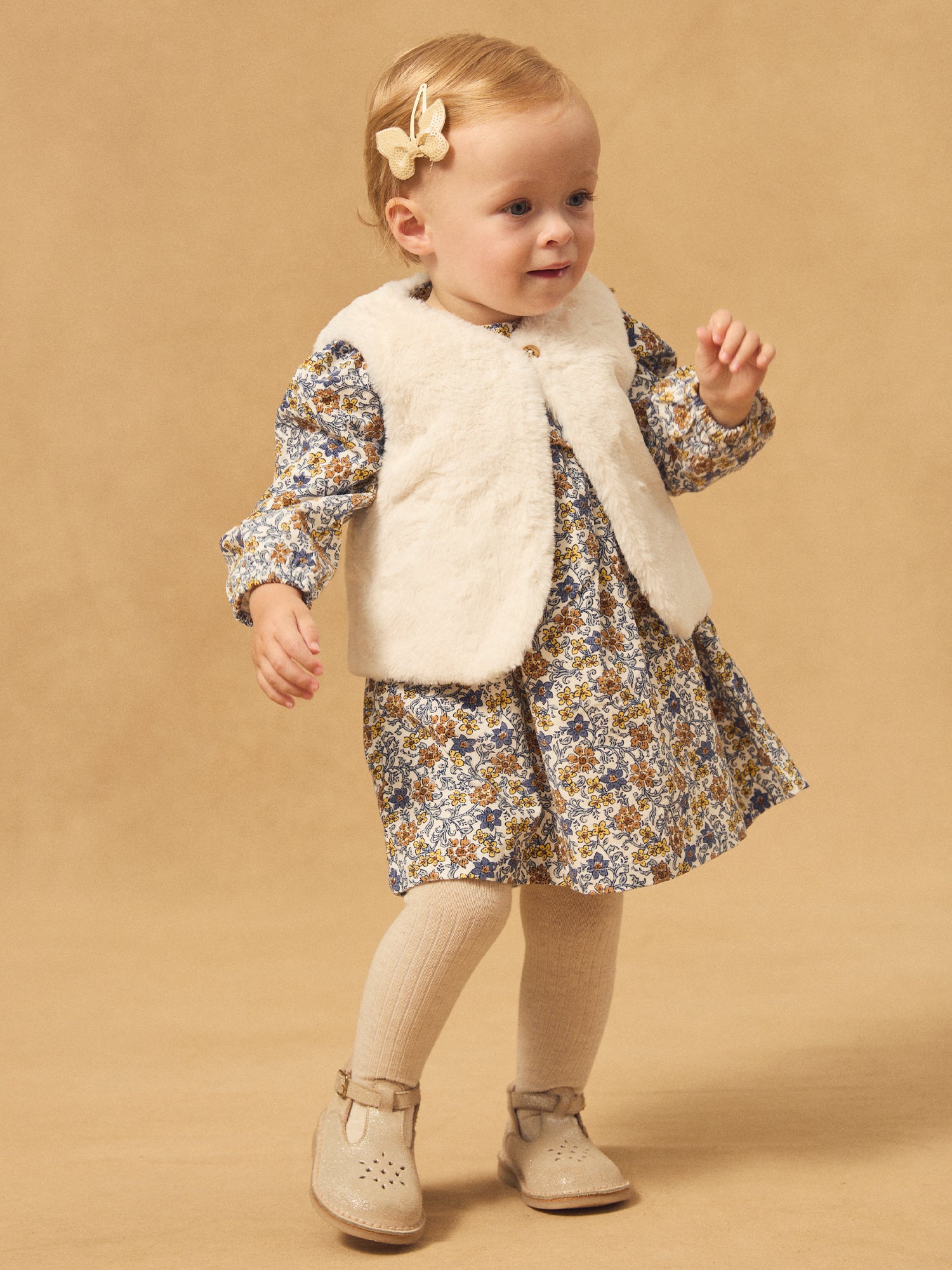 Gilet réversible blanc en fourrure ou imprimé fleuri Bébé Fille