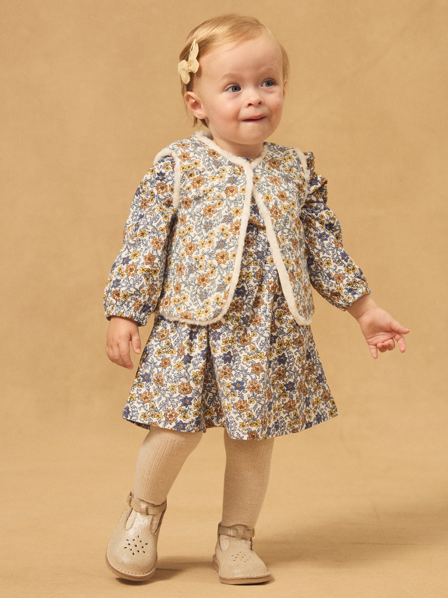 Gilet réversible blanc en fourrure ou imprimé fleuri Bébé Fille