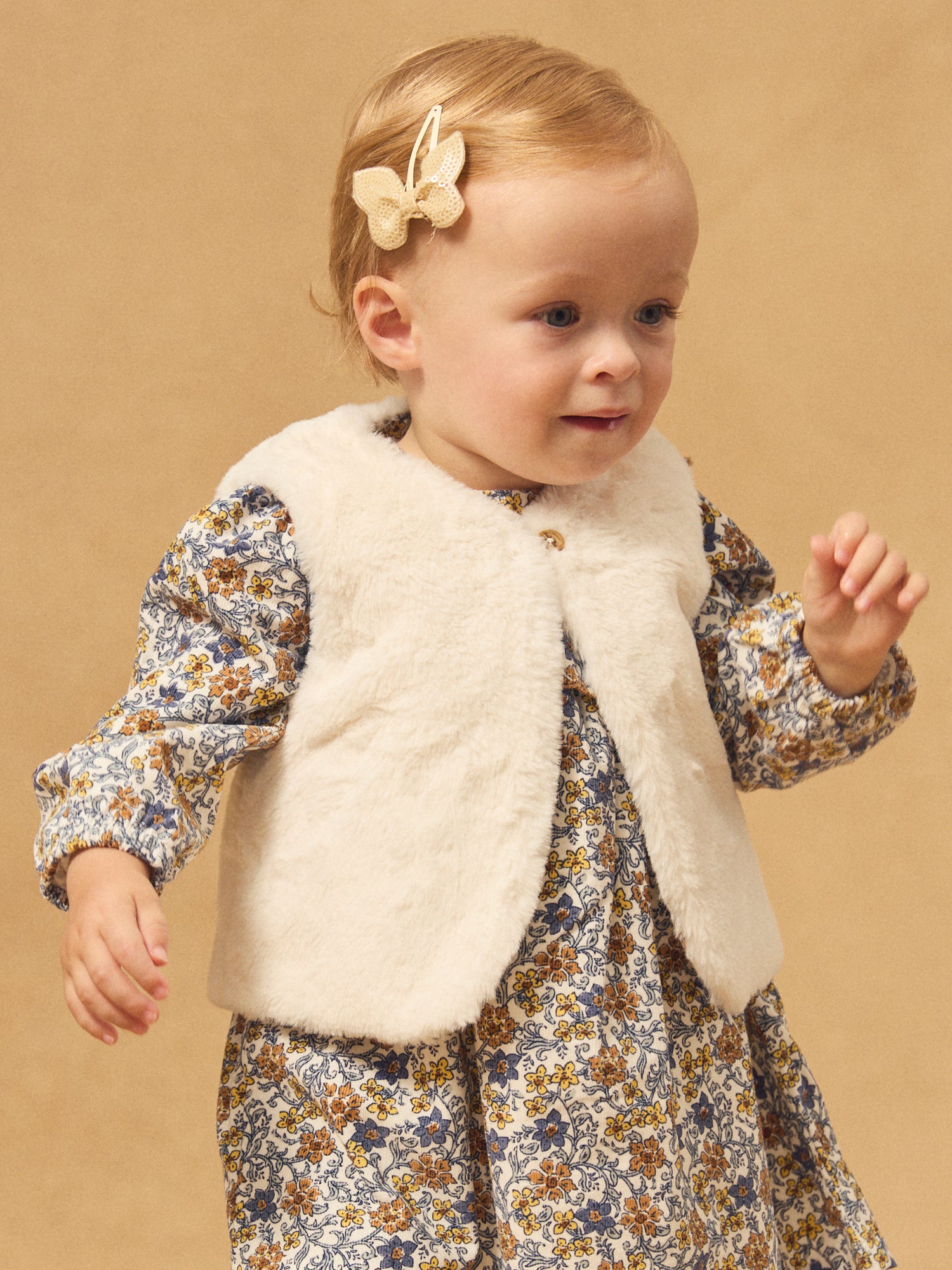 Gilet réversibles blanc en fourrure ou imprimé fleuri Bébé Fille