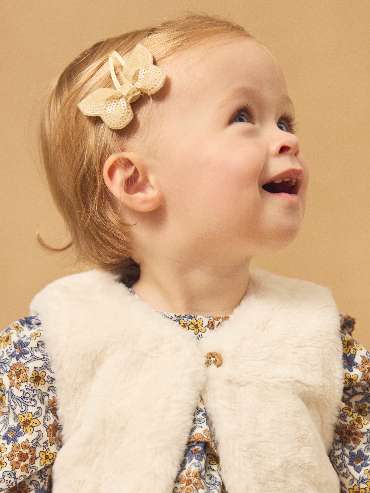 Gilet réversibles blanc en fourrure ou imprimé fleuri Bébé Fille