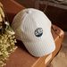Casquette à rayures beige et bleu