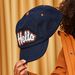 Casquette chaude avec animation en bouclettes Hello