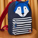 Sac à dos à rayures et animation loup en canvas