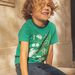 T-shirt vert dinosaure et vélos phosphorescents