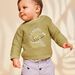Pull kaki clair en tricot à broderie dinosaure