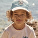 Casquette turquoise en twill à motif dinosaure