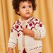 Gilet en tricot rouge et beige